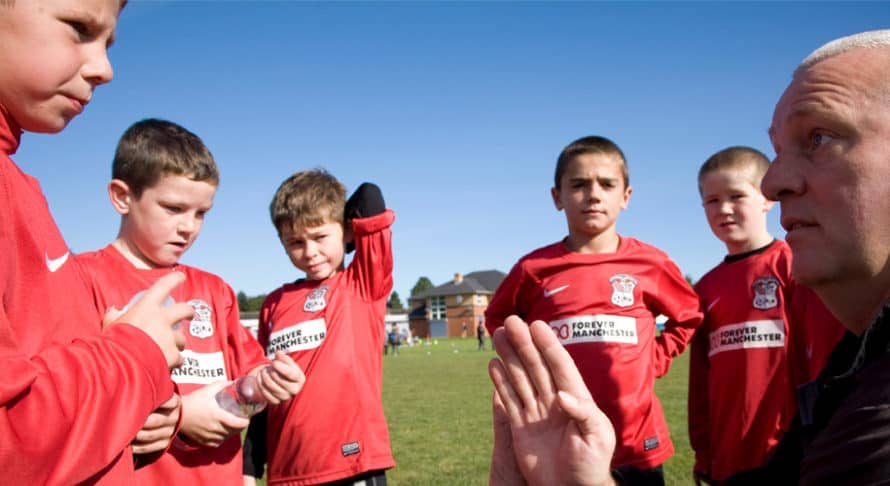 children playing football