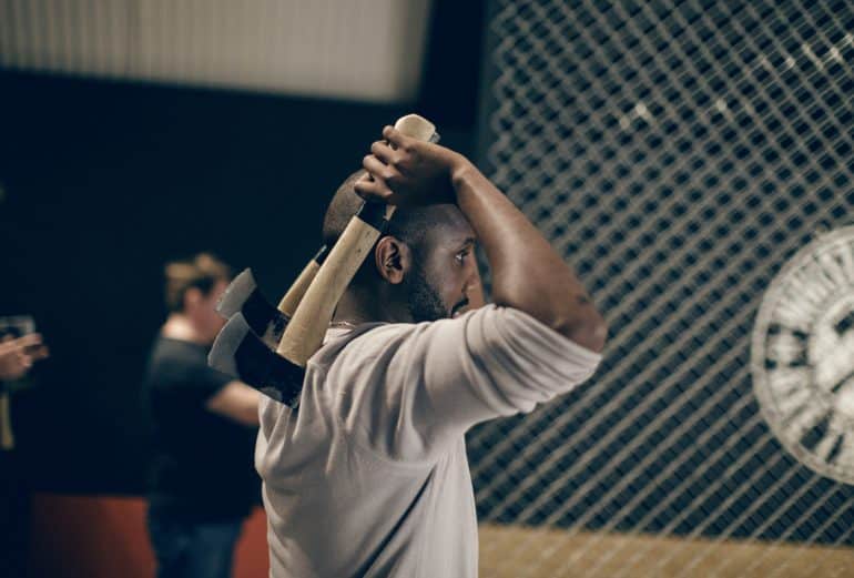 A man throwing an axe